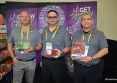 Produce like it’s 1999. Purple is the color in the booth of Mucci Farms. From left to right: Steve Zaccardi, Nick Allen and Danny Elias, showing Cucumber Poppers, Smuccies and Cherto tomatoes.